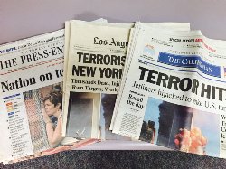 Historical headlines as shown in local newspapers from September 12, 2001 following the 911 attack.